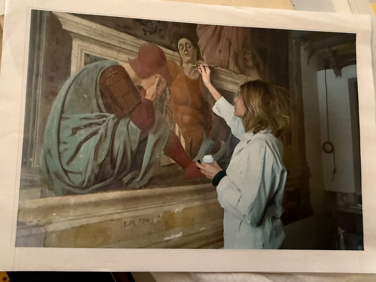 Art conservator restoring a fresco
